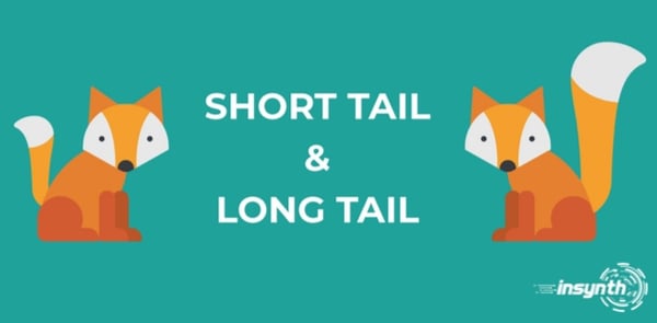 Two foxes, one with a short tail and one with a log tail. 