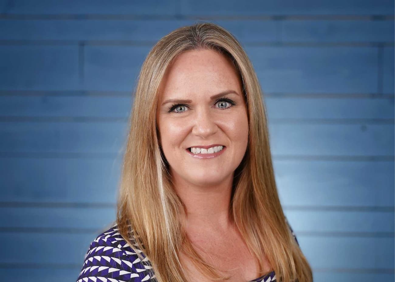 Louise urquhart head of design smiling at camera